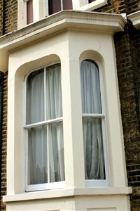 Hang Roman shades to accentuate benefits of bay windows