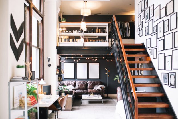 Cozy loft apartment interior in Downtown Los Angeles featuring Blinds Chalet Roller Shades