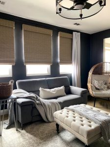 after photos of media room update project - Adding natural woven shades can quickly update your space. // Get the look with Bali Natural Woven Shades in Spree Studio. // Credit: @woolandvinedesign.