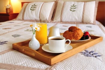 bed linens with breakfast in bed