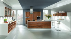 Adding glass surfaces, such as glass-paned cabinet doors, opens up a kitchen.