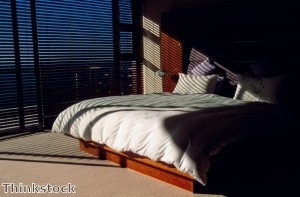 Blackout shades can prevent light from seeping into a bedroom and disturbing one's sleep.