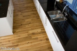 Rugs soften the look of kitchens with wood flooring.