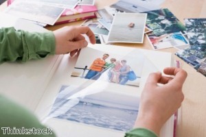 Choosing family photos for a display should take into account the image size and frame color to create a unified collection.