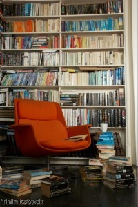Bookcase space can be split between open shelving and hidden storage.