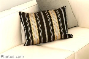 Cushions in neutral, but interesting patterns can revive the look of upholstered furniture.