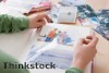 Choosing family photos for a display should take into account the image size and frame color to create a unified collection.