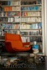 Bookcase space can be split between open shelving and hidden storage.