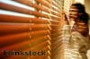 Faux wood blinds have the rich look of wood with the easy care of manmade materials.