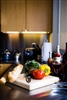 Woven shades can can complete kitchen
