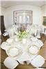 Design a natural, intimate dining room with wood blinds