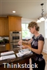 Installing a kitchen desk gives homeowners a comfortable place to take care of bill-paying and other paperwork.