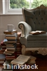 A decorative throw can add color and comfort to a reading area.