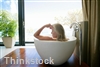 Decorate a bathroom with faux wood blinds
