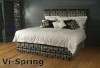 An upholstered headboard can be part of a bed ensemble.