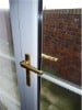 Softer, burnished metals have become popular finishes for door handles and other hardware.