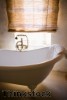 Natural materials used in bathroom decor can warm up the look of the room.
